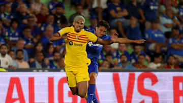 GETAFE, SPAIN - AUGUST 13: Ronald Araujo of FC Barcelona is tackled by Jaime Mata of Getafe CF during the LaLiga EA Sports match between Getafe CF and FC Barcelona at Coliseum Alfonso Perez on August 13, 2023 in Getafe, Spain. (Photo by Florencia Tan Jun/Getty Images)