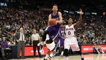 Mar 9, 2015; Atlanta, GA, USA; Sacramento Kings guard Nik Stauskas (10) shoots the ball past Atlanta Hawks guard Jeff Teague (0) in the second quarter at Philips Arena. Mandatory Credit: Brett Davis-USA TODAY Sports