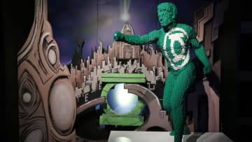 PARIS, FRANCE - APRIL 26: the character dressed in green from the movie "Green Lantern" made with Lego bricks by US artist Nathan Sawaya is displayed during the press preview of the exhibition "The Art of the Brick: DC Super Heroes"at Parc de la Villette on April 26, 2018 in Paris, France. Created by Nathan Sawaya, this Lego exhibition, aimed at fans and the whole family, uses 2,000m2 of over 2 million bricks for more than 120 original creations including gigantic sculptures inspired by the DC Comics universe: Batman, Superman, Wonder Woman, The Joker ... and a 5.5m life-size Batmobile that alone required 489,019 pieces Lego. This exhibition runs from April 29 to August 19 2018. (Photo by Thierry Chesnot/Getty Images)