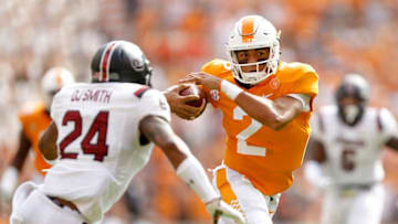 KNOXVILLE, TN - OCTOBER 14: Jarrett Guarantano #2 of the Tennessee Volunteers runs with the ball defended by D.J. Smith #24 of the South Carolina Gamecocks during the first half at Neyland Stadium on October 14, 2017 in Knoxville, Tennessee. (Photo by Michael Reaves/Getty Images)