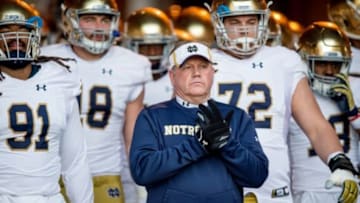 Nov 28, 2015; Stanford, CA, USA; Notre Dame Fighting Irish head coach Brian Kelly leads his team onto the field against the Stanford Cardinal at Stanford Stadium. Stanford won 38-36.Mandatory Credit: Matt Cashore-USA TODAY Sports