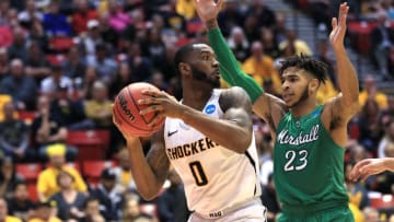 SAN DIEGO, CA - MARCH 16: Rashard Kelly #0 of the Wichita State Shockers handles the ball against Rondale Watson #23 of the Marshall Thundering Herd in the second half during the first round of the 2018 NCAA Men's Basketball Tournament at Viejas Arena on March 16, 2018 in San Diego, California. (Photo by Sean M. Haffey/Getty Images)