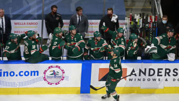 EDMONTON, ALBERTA - AUGUST 07: Joel Eriksson Ek #14 of the Minnesota Wild is congratulated by his teammates after scoring a goal against the Vancouver Canucks during the second period in Game Four of the Western Conference Qualification Round prior to the 2020 NHL Stanley Cup Playoffs at Rogers Place on August 07, 2020 in Edmonton, Alberta. (Photo by Jeff Vinnick/Getty Images)
