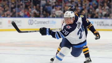 BUFFALO, NY - FEBRUARY 23: Cody Eakin #20 of the Winnipeg Jets takes a shot on goal during the first period against the Buffalo Sabres at KeyBank Center on February 23, 2020 in Buffalo, New York. (Photo by Timothy T Ludwig/Getty Images)