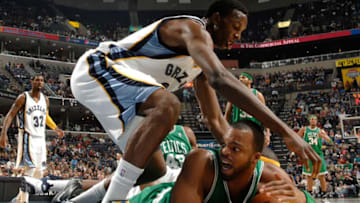 MEMPHIS, TN - DECEMBER 14: Hasheem Thabeet #34 of the Memphis Grizzlies scrambles for a loose ball against Sheldon WIlliams #13 of the Boston Celtics on December 14, 2009 at FedExForum in Memphis, Tennessee. NOTE TO USER: User expressly acknowledges and agrees that, by downloading and or using this photograph, User is consenting to the terms and conditions of the Getty Images License Agreement. Mandatory Copyright Notice: Copyright 2009 NBAE (Photo by Joe Murphy/NBAE via Getty Images)