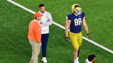 Nov 5, 2022; South Bend, Indiana, USA; Clemson Tigers head coach Dabo Swinney and Notre Dame Fighting Irish head coach Marcus Freeman talk before a game at Notre Dame Stadium. Mandatory Credit: Matt Cashore-USA TODAY Sports