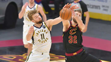 CLEVELAND, OHIO - MARCH 03: Domantas Sabonis #11 of the Indiana Pacers and Dean Wade #32 of the Cleveland Cavaliers fight for a loose ball during the second quarter at Rocket Mortgage Fieldhouse on March 03, 2021 in Cleveland, Ohio. NOTE TO USER: User expressly acknowledges and agrees that, by downloading and/or using this photograph, user is consenting to the terms and conditions of the Getty Images License Agreement. (Photo by Jason Miller/Getty Images)
