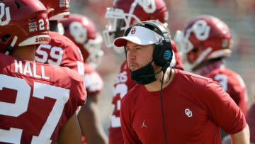 Oklahoma coach Lincoln Riley talks with his team during the Red River Showdown college football game between the University of Oklahoma Sooners (OU) and the Texas Longhorns (UT) at Cotton Bowl Stadium in Dallas, Saturday, Oct. 10, 2020. Oklahoma won 53-45 in four overtimes. [Bryan Terry/The Oklahoman]40f375d60fb93a5341c7d74c8f9203eb