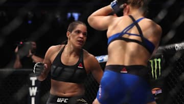 LAS VEGAS, NV - DECEMBER 30: (L-R) Amanda Nunes of Brazil punches Ronda Rousey in their UFC women's bantamweight championship bout during the UFC 207 event on December 30, 2016 in Las Vegas, Nevada. (Photo by Christian Petersen/Getty Images)