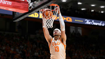 KNOXVILLE, TENNESSEE - JANUARY 28: Olivier Nkamhoua #13 of the Tennessee Volunteers completes an alley-oop against the Texas Longhorns in the second half at Thompson-Boling Arena on January 28, 2023 in Knoxville, Tennessee. (Photo by Eakin Howard/Getty Images)