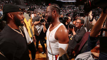 Chris Paul and Dwyane Wade #3 of the Miami Heat talk after a game between the Miami Heat and the Brooklyn Nets (Photo by Issac Baldizon/NBAE via Getty Images)