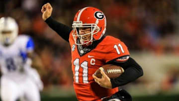 Nov 23, 2013; Athens, GA, USA; Georgia Bulldogs quarterback Aaron Murray (11) runs the ball in the first half against the Kentucky Wildcats at Sanford Stadium. Mandatory Credit: Daniel Shirey-USA TODAY Sports