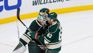 Dec 11, 2016; Saint Paul, MN, USA; Minnesota Wild forward Kurtis Gabriel (63) congratulates goalie Devan Dubnyk (40) after the game against the St Louis Blues at Xcel Energy Center. The Minnesota Wild beat the St Louis Blues 3-1. Mandatory Credit: Brad Rempel-USA TODAY Sports