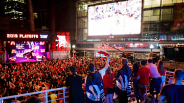 TORONTO, ON - JUNE 07: Toronto Raptors fans gather to watch Game 4 of the NBA Finals series outside Scotiabank Arena at 'Jurassic Park', on June 7, 2019 in Toronto, Canada. (Photo by Cole Burston/Getty Images)