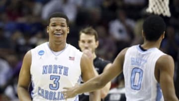 Mar 21, 2014; San Antonio, TX, USA; North Carolina Tar Heels forward Kennedy Meeks (3) smiles with North Carolina Tar Heels guard Nate Britt (0) in the first half of a men