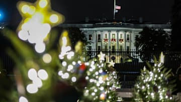 WASHINGTON, USA - DECEMBER 6: The White House Christmas Tree sits lit in the rear on the Ellipse of the White House in Washington, surrounded by smaller trees representing the 50 states White House in Washington, DC. December 6, 2021 (Photo by Yasin Ozturk/Anadolu Agency via Getty Images)