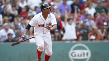 Jun 23, 2016; Boston, MA, USA; Boston Red Sox shortstop Xander Bogaerts (2) hits a single to drive in the winning run during the tenth inning against the Chicago White Sox at Fenway Park. The Boston Red Sox won 8-7. Mandatory Credit: Greg M. Cooper-USA TODAY Sports