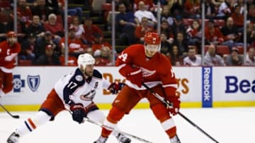 Feb 23, 2016; Detroit, MI, USA; Detroit Red Wings center Gustav Nyquist (14) skates with the puck defended by Columbus Blue Jackets center Brandon Dubinsky (17) in overtime at Joe Louis Arena. Detroit won 2-1in a overtime shootout. Mandatory Credit: Rick Osentoski-USA TODAY Sports