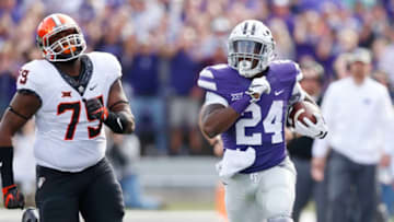 Kansas State running back Charles Jones (24) carries the ball down the sideline in the first half against Oklahoma State and defensive tackle Darrion Daniels (79)at Bill Snyder Family Stadium in Manhattan, Kan., on Saturday, Nov. 5, 2016. (Bo Rader/Wichita Eagle/TNS via Getty Images)