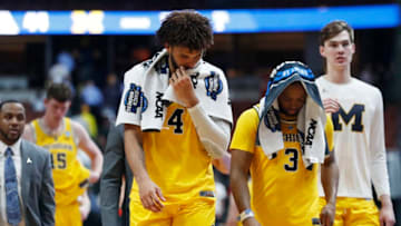 ANAHEIM, CALIFORNIA - MARCH 28: Isaiah Livers #4 and Zavier Simpson #3 of the Michigan Wolverines show their dejection after their loss to the Texas Tech Red Raiders during the 2019 NCAA Men's Basketball Tournament West Regional at Honda Center on March 28, 2019 in Anaheim, California. (Photo by Sean M. Haffey/Getty Images)
