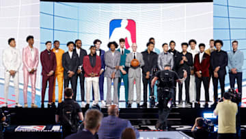 NEW YORK, NEW YORK - JULY 29: NBA commissioner Adam Silver (C) poses for photos with members of the 2021 draft class during the 2021 NBA Draft at the Barclays Center on July 29, 2021 in New York City. (Photo by Arturo Holmes/Getty Images)