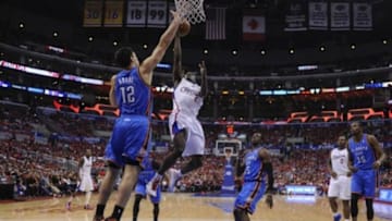 May 9, 2014; Los Angeles, CA, USA; Oklahoma City Thunder center Steven Adams (12) blocks a shot by Los Angeles Clippers guard Darren Collison (2) during the second half of game three of the second round of the 2014 NBA Playoffs at Staples Center. Mandatory Credit: Robert Hanashiro-USA TODAY Sports