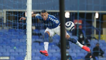 LIVERPOOL, ENGLAND - MARCH 01: Richarlison of Everton scores their team's first goal during the Premier League match between Everton and Southampton at Goodison Park on March 01, 2021 in Liverpool, England. Sporting stadiums around the UK remain under strict restrictions due to the Coronavirus Pandemic as Government social distancing laws prohibit fans inside venues resulting in games being played behind closed doors. (Photo by Clive Brunskill/Getty Images)