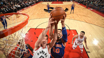 TORONTO, CANADA - NOVEMBER 17: Enes Kanter #00 of the New York Knicks dunks against Jakob Poeltl #42 of the Toronto Raptors on November 17, 2017 at the Air Canada Centre in Toronto, Ontario, Canada. Copyright 2017 NBAE (Photo by Ron Turenne/NBAE via Getty Images)