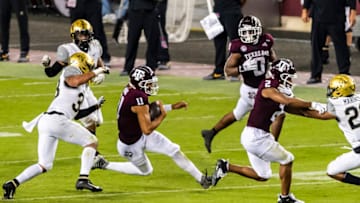 Sep 26, 2020; College Station, Texas, USA; Texas A&M Aggies quarterback Kellen Mond (11) runs the ball during the third quarter against Vanderbilt Commodores safety Dashaun Jerkins (33) and defensive back Donovan Kaufman (1) at Kyle Field. Mandatory Credit: Maria Lysaker-USA TODAY SportsAuburn football