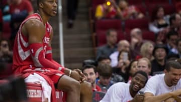 Feb 5, 2014; Houston, TX, USA; Houston Rockets center Dwight Howard (12) watches from the bench during the second half of the game against the Phoenix Suns at the Toyota Center. Howard leads his team with 34 points and 14 rebounds. The Rockets defeated the Suns 122-108. Mandatory Credit: Jerome Miron-USA TODAY Sports