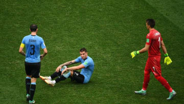 Uruguay's goalkeeper Fernando Muslera (R) and Uruguay's defender Diego Godin (L) walk over to console Uruguay's defender Jose Gimenez after their loss during the Russia 2018 World Cup quarter-final football match between Uruguay and France at the Nizhny Novgorod Stadium in Nizhny Novgorod on July 6, 2018. - France became the first team to reach the World Cup semi-finals on Friday after an assured 2-0 win against Uruguay. (Photo by Johannes EISELE / AFP) (Photo credit should read JOHANNES EISELE/AFP/Getty Images)