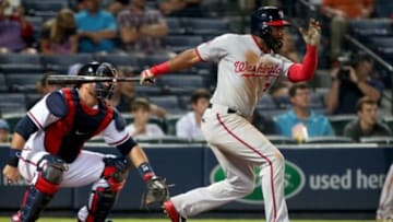 Jul 1, 2015; Atlanta, GA, USA; Washington Nationals center fielder Denard Span (2) hits an RBI single as Atlanta Braves catcher A.J. Pierzynski (15) is shown on the play in the seventh inning of their game at Turner Field. The Braves won 4-1. Mandatory Credit: Jason Getz-USA TODAY Sports