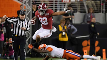 SANTA CLARA, CA - JANUARY 07: Irv Smith Jr. #82 of the Alabama Crimson Tide leaps past Trayvon Mullen #1 of the Clemson Tigers during the first quarter in the CFP National Championship presented by AT&T at Levi's Stadium on January 7, 2019 in Santa Clara, California. (Photo by Harry How/Getty Images)