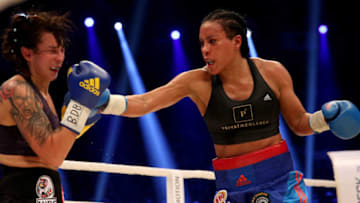 HALLE, GERMANY - FEBRUARY 27: Cecilia Braekhus punshes Chris Namus during their Welterweight World Championship fight prior to the IBO Cruiserweight World Championship fight between Marco Huck and Ola Afolabi at Gerry Weber Stadium on February 27, 2016 in Halle, Germany. (Photo by Lars Baron/Bongarts/Getty Images)