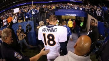 Oct 20, 2013; Indianapolis, IN, USA; Denver Broncos quarterback Peyton Manning (18) walks off the field after the game against the Indianapolis Colts at Lucas Oil Stadium. Mandatory Credit: Brian Spurlock-USA TODAY Sports