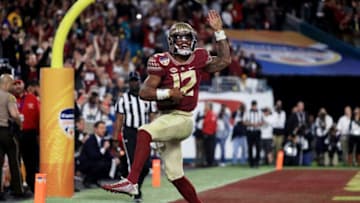 MIAMI GARDENS, FL - DECEMBER 30: Deondre Francois #12 of the Florida State Seminoles celebrates scoring a touchdown in the fourth quarteragainst the Michigan Wolverines during the Capitol One Orange Bowl at Sun Life Stadium on December 30, 2016 in Miami Gardens, Florida. (Photo by Mike Ehrmann/Getty Images)