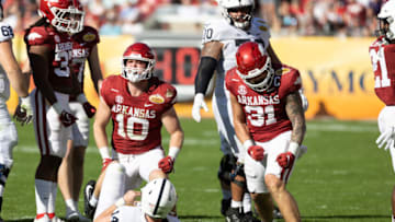 Arkansas Razorbacks linebacker Bumper Pool and Grant Morgan celebrate a sack against Penn State. USA Today.