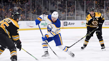 Apr 28, 2022; Boston, Massachusetts, USA; Buffalo Sabres defenseman Jacob Bryson (78) shoots the puck while Boston Bruins defenseman Brandon Carlo (25) defends during the third period at TD Garden. Mandatory Credit: Bob DeChiara-USA TODAY Sports