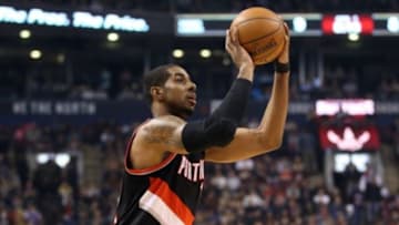 Mar 15, 2015; Toronto, Ontario, CAN; Portland Trail Blazers forward LaMarcus Aldridge (12) shoots and scores a basket against the Toronto Raptors at Air Canada Canada Centre. The Trail Blazers beat the Raptors 113-97. Mandatory Credit: Tom Szczerbowski-USA TODAY Sports
