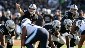 Aug 27, 2016; Oakland, CA, USA; Oakland Raiders quarterback Derek Carr (4) calls a play against the Tennessee Titans in the first quarter at Oakland Alameda Coliseum. Mandatory Credit: Cary Edmondson-USA TODAY Sports