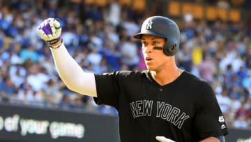 LOS ANGELES, CA - AUGUST 25: Aaron Judge #99 of the New York Yankees crosses the plate after hitting a solo home run in the third inning of the game against the Los Angeles Dodgers at Dodger Stadium on August 25, 2019 in Los Angeles, California. Teams are wearing special color schemed uniforms with players choosing nicknames to display for Players' Weekend. (Photo by Jayne Kamin-Oncea/Getty Images)