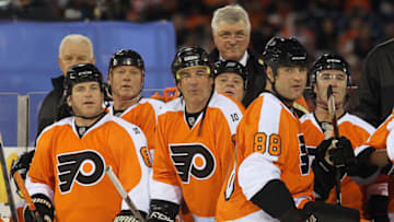 PHILADELPHIA, PA - DECEMBER 31: (L-R) Mark Recchi #8, John Leclair #10 and Eric Lindros #88 of the Philadelphia Flyers look on against the New York Rangers during the 2012 Bridgestone NHL Winter Classic Alumni Game on December 31, 2011 at Citizens Bank Park in Philadelphia, Pennsylvania. (Photo by Jim McIsaac/Getty Images)