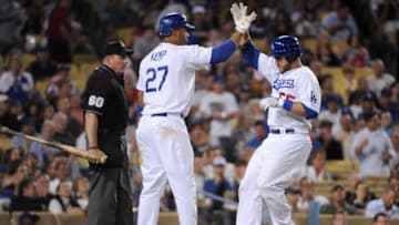LOS ANGELES - AUGUST 20: Russell Martin #55 of the Los Angeles Dodgers celebrates at home plate with teammate Matt Kemp #27 after scoring a run in the second inning against the Chicago Cubs during the game at Dodger Stadium on August 20, 2009 in Los Angeles, California. (Photo by Harry How/Getty Images)