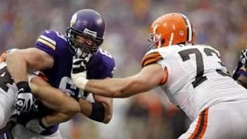 Sep 22, 2013; Minneapolis, MN, USA; Cleveland Browns tight end Jordan Cameron (84) and offensive lineman Joe Thomas (73) block Minnesota Vikings defensive end Jared Allen (69) at Mall of America Field at H.H.H. Metrodome. The Browns win 31-27. Mandatory Credit: Bruce Kluckhohn-USA TODAY Sports