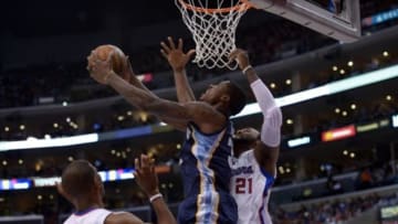 Mar 13, 2013; Los Angeles, CA, USA; Memphis Grizzlies forward Ed Davis (32) is defended by Los Angeles Clippers guard Chris Paul (3) and forward Ronny Turiaf (21) at the Staples Center. Mandatory Credit: Kirby Lee-USA TODAY Sports
