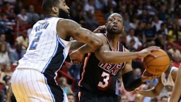 Mar 1, 2014; Miami, FL, USA; Miami Heat shooting guard Dwyane Wade (3) drives to the basket as Orlando Magic power forward Kyle O