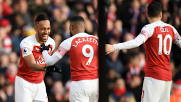 LONDON, ENGLAND - DECEMBER 22: Pierre-Emerick Aubameyang of Arsenal celebrates after scoring his team's second goal with Alexandre Lacazette of Arsenal and Mesut Ozil of Arsenal during the Premier League match between Arsenal FC and Burnley FC at Emirates Stadium on December 22, 2018 in London, United Kingdom. (Photo by Shaun Botterill/Getty Images)