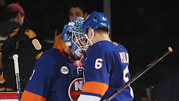 NEW YORK, NY - NOVEMBER 03: Ryan Pulock #6 of the New York Islanders and Thomas Greiss #1 of the New York Islanders celebrate after game against the New Jersey Devils at Barclays Center on November 3, 2018 in the Brooklyn bourough of New York City. The New York Islanders defeated the New Jersey Devils 3-0. (Photo by Andy Marlin/NHLI via Getty Images)