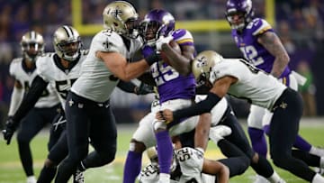 MINNEAPOLIS, MN - JANUARY 14: Latavius Murray #25 of the Minnesota Vikings is tackled by Manti Te'o #51 of the New Orleans Saints during the second half of the NFC Divisional Playoff game at U.S. Bank Stadium on January 14, 2018 in Minneapolis, Minnesota. (Photo by Jamie Squire/Getty Images)