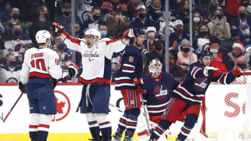 Dec 17, 2021; Winnipeg, Manitoba, CAN; Washington Capitals left wing Alex Ovechkin (8) celebrates the second period goal by Washington Capitals right wing Daniel Sprong (10) on Winnipeg Jets at Canada Life Centre. Mandatory Credit: James Carey Lauder-USA TODAY Sports